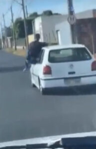 Read more about the article Driver Pretends To Surf On The Roof Of His Moving Vehicle In Middle Of Traffic