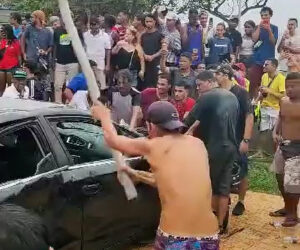 Man Keeps Hand On Car To Win It But Others Wreck It