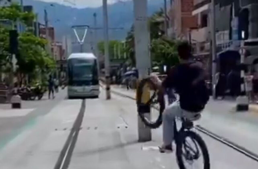 Wheelie Cyclist Almost Crashes With Tram