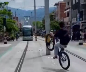 Wheelie Cyclist Almost Crashes With Tram